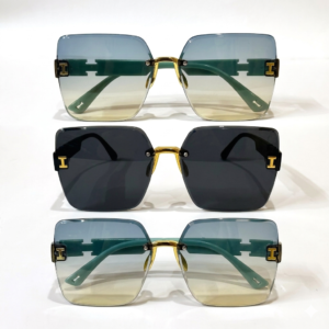 Three pairs of Vanguard geometric rimless sunglasses stacked vertically, showing teal gradient and solid black lens options with gold "H" temple accents.Vanguard™ Luxe Sunglasses || UV Protection